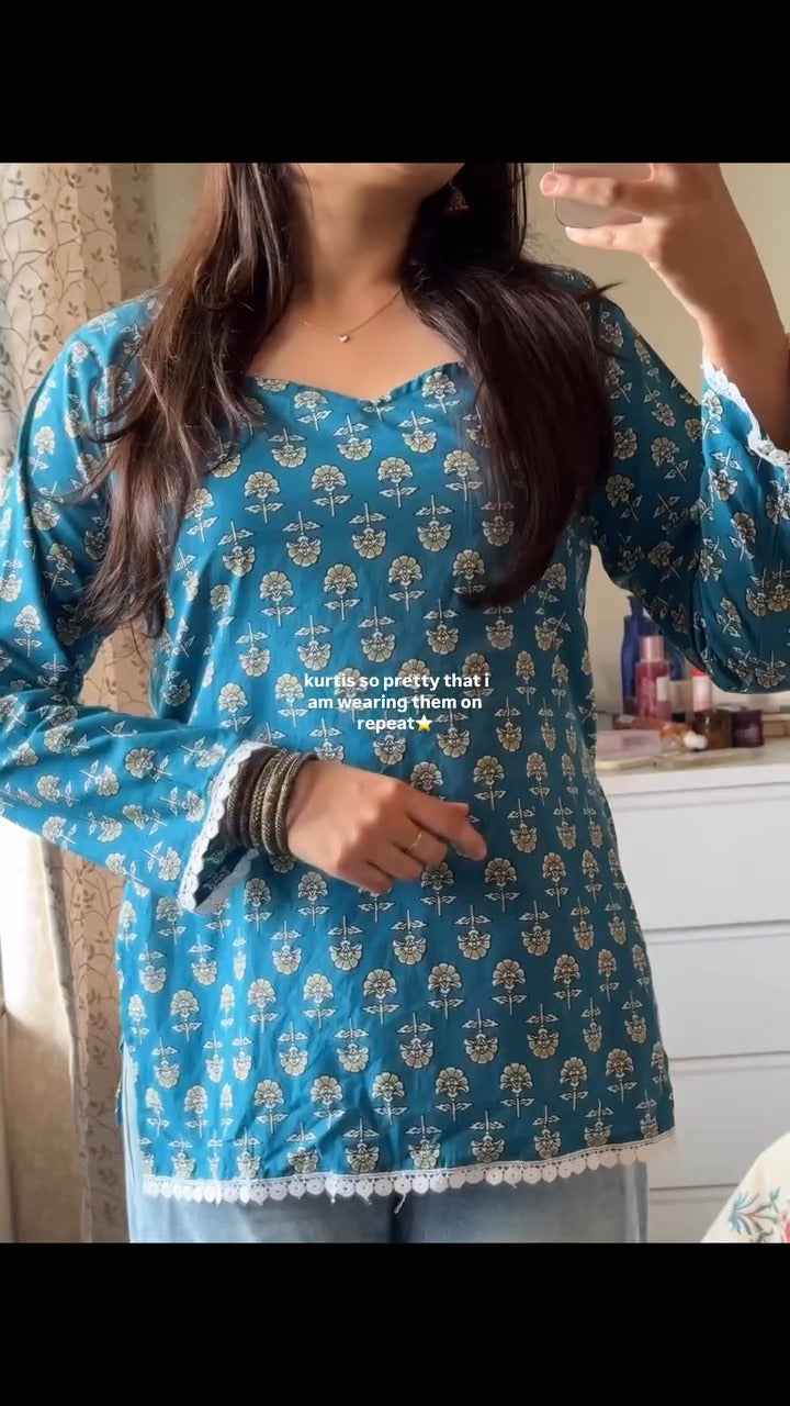 blue, printed short kurti.( fabric is likely breathable, Poly rayon)