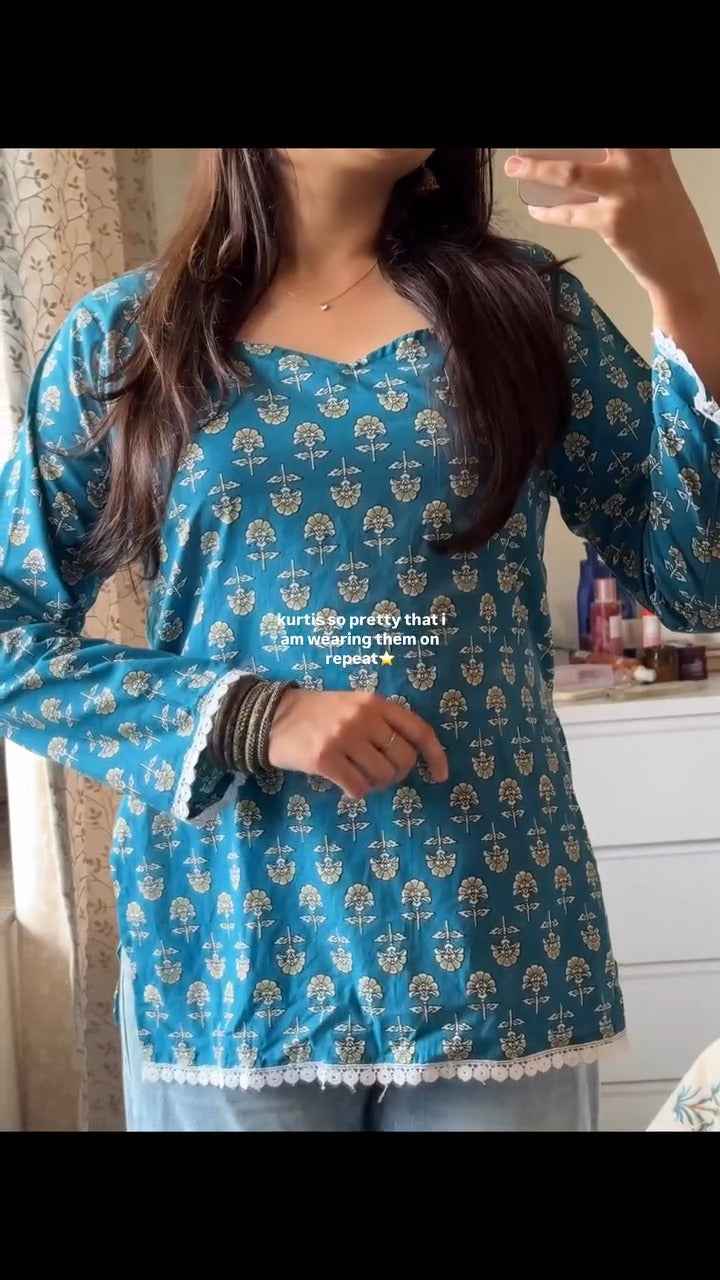 blue, printed short kurti.( fabric is likely breathable, Poly rayon)
