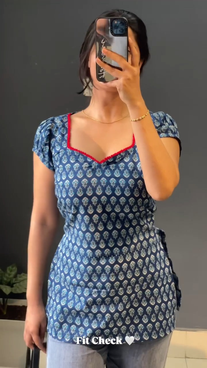 blue and white patterned kurti with a distinctive red border