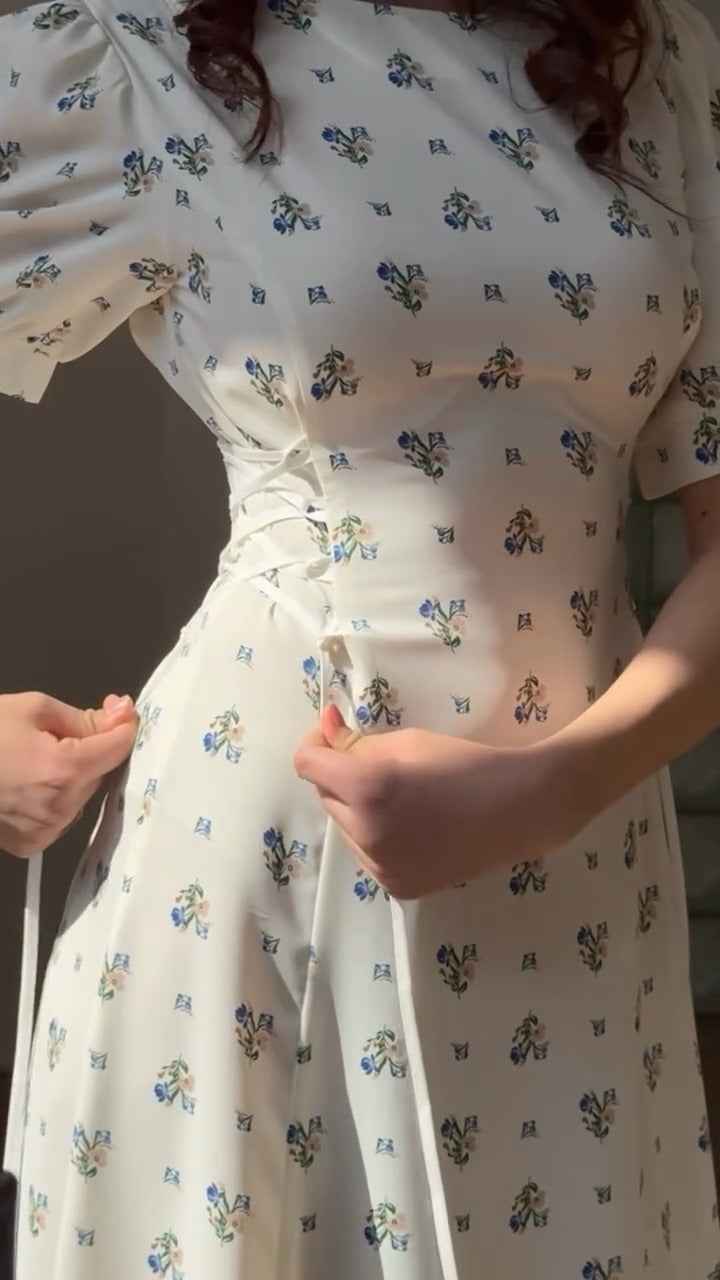 white midi dress with a blue floral print ( fabric is likely breathable, Poly rayon)