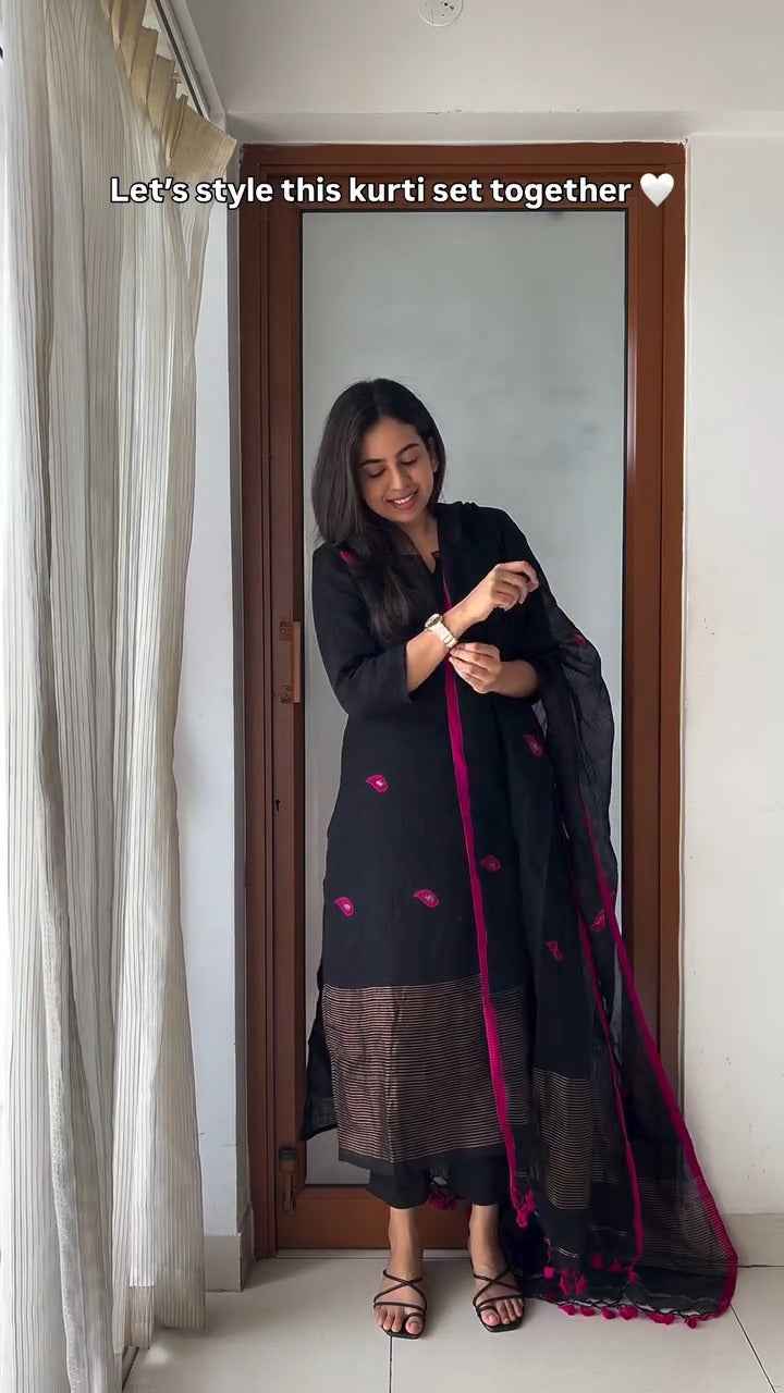 black kurti set with vibrant pink embroidery,