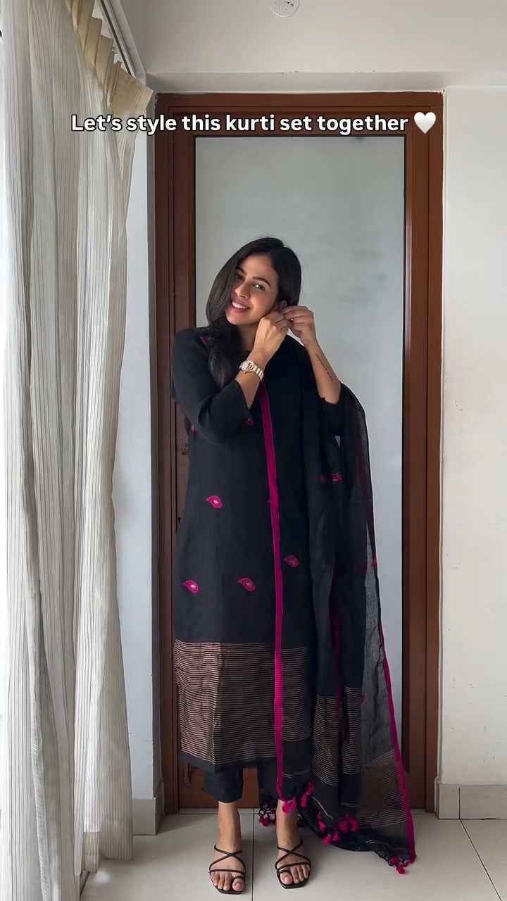 black kurti set with vibrant pink embroidery,