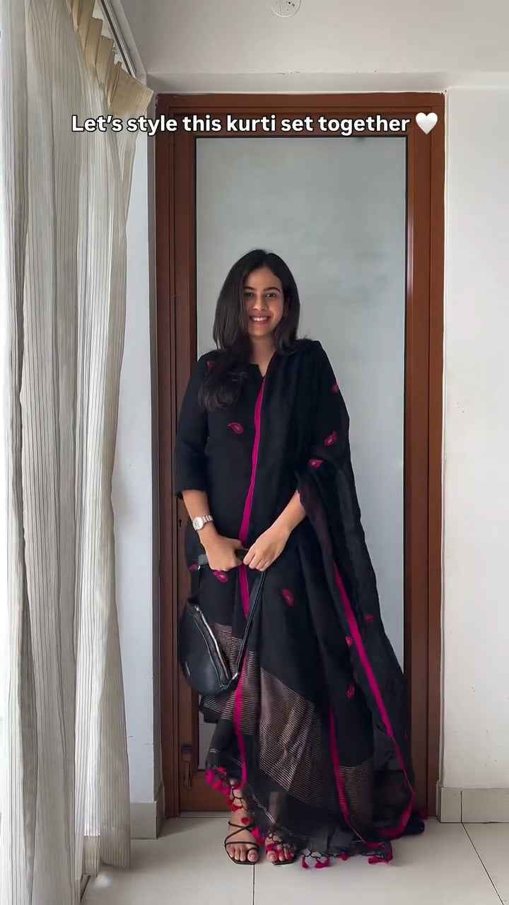 black kurti set with vibrant pink embroidery,